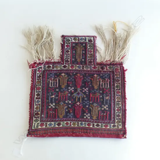 A Turkish Kurdish woven salt bag, decorated with animal and bird motifs,